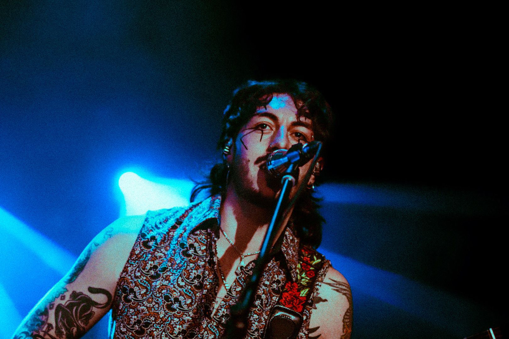Singer in blue stage light