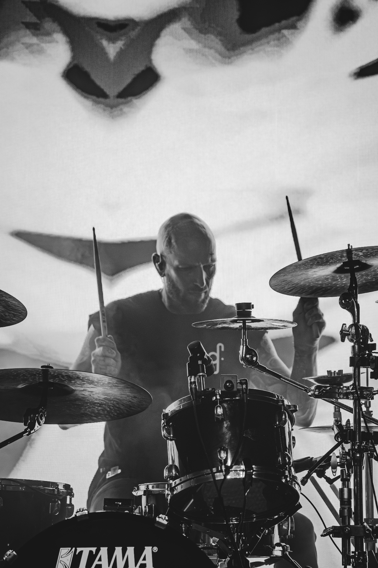 Drummer playing live black and white