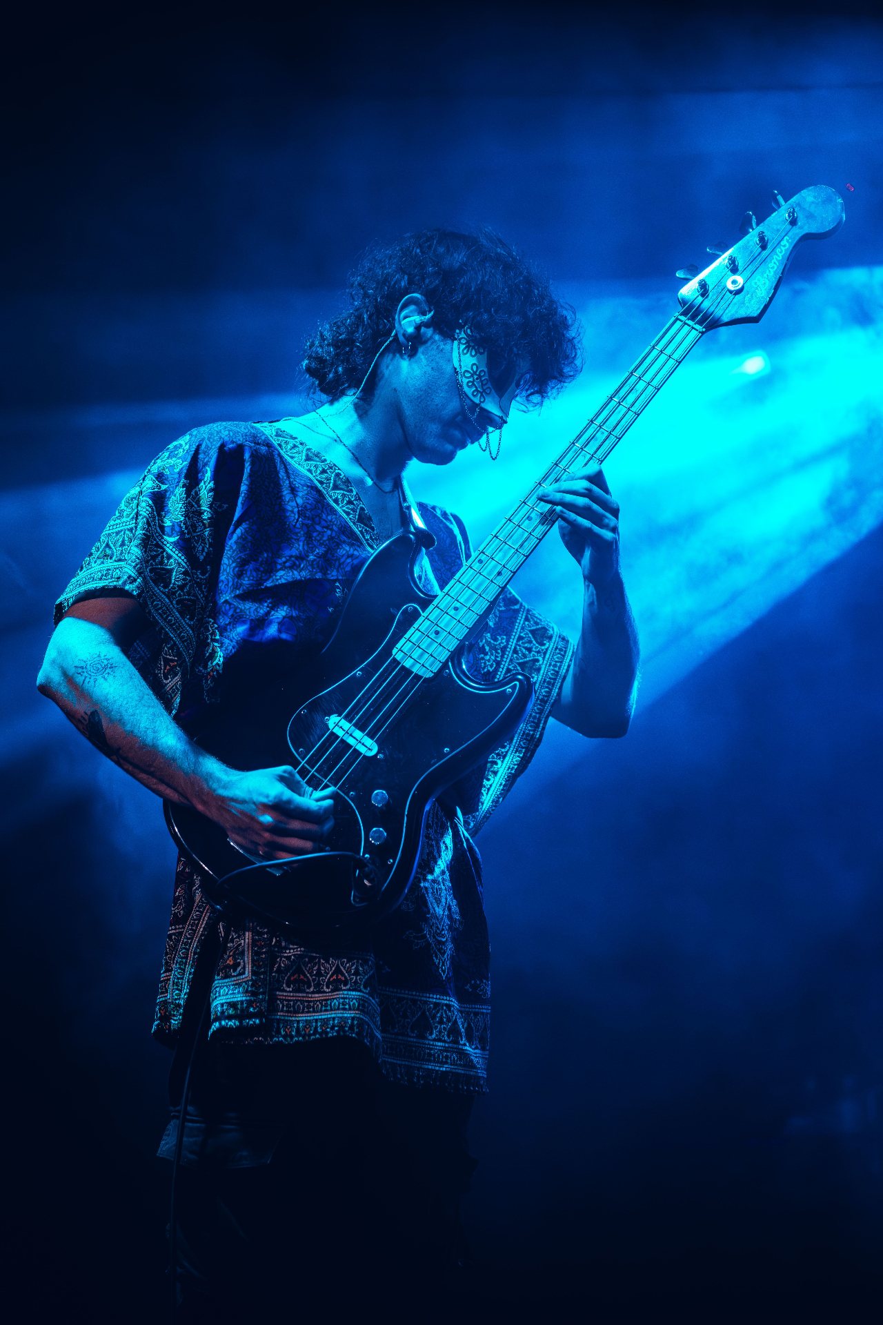 Bassist in deep blue light