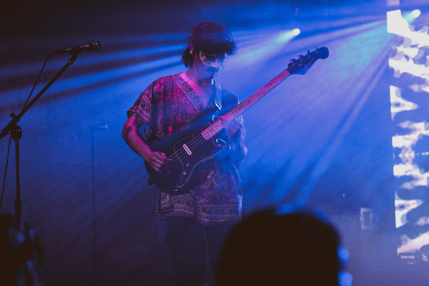 Bassist with mask on stage